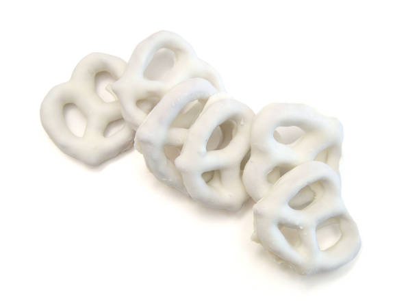 istock White chocolate covered pretzels on white background 2157961726