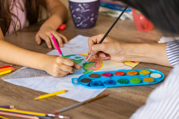 istock Mother helping daughter for homework 2157963687