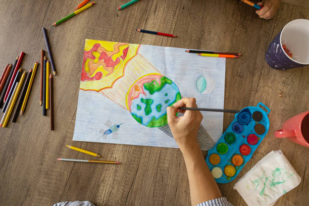 istock Creative school girl drawing the art about environment 2157964392