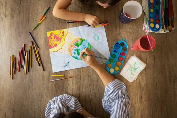 istock Creative school girl drawing the art about environment 2157964393
