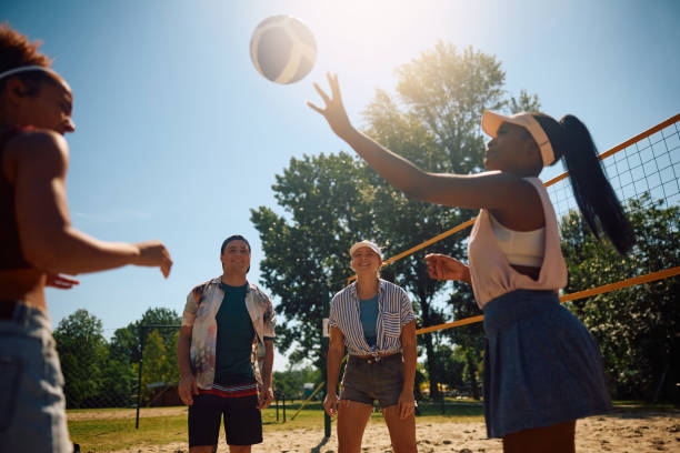 istock Young happy people playing volleyball on the beach. 2157966129