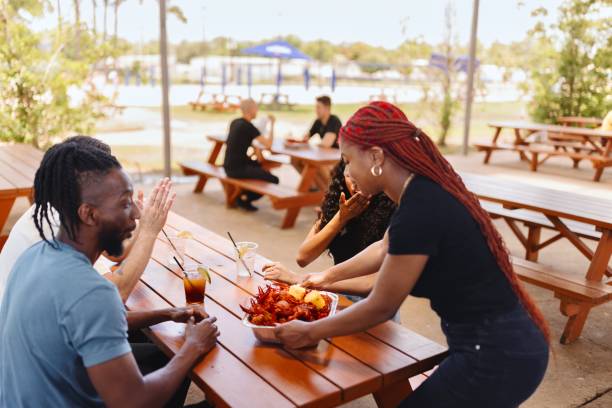 istock The waitress serves seafood to her customers 2157967920