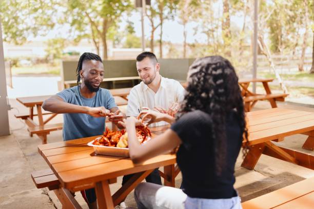 istock People eating crawfish at the restaurant outdoors 2157967949