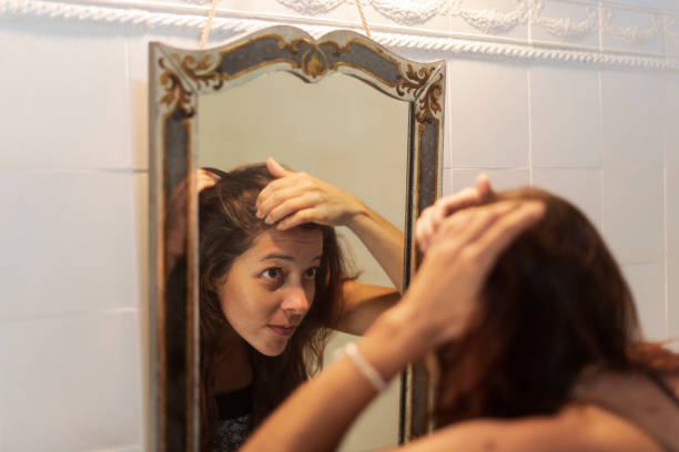 istock Woman in Front Of a Mirror 2157969092