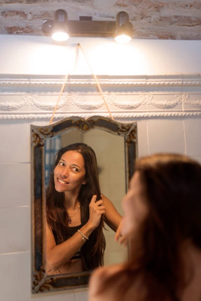 istock Woman in Front Of a Mirror 2157969094