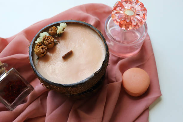 istock original decorative candle in a coconut. natural soy 2157973138