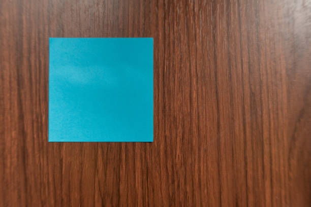 Blank adhesive paper on wooden table