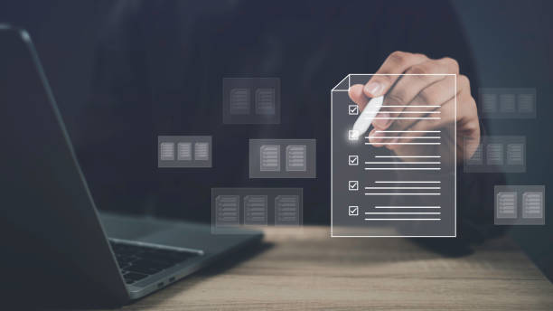 istock Businessman tick correct sign mark in checkbox. Checklist digital online form and document management, Online digital survey filling out and business office approve file project by computer. 2157976972