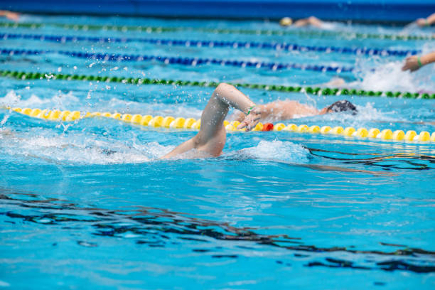 istock Professional swimmers in a Swimming Pool 2157979582