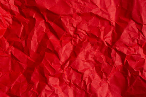 istock wrinkled red paper texture,Rectangular crumpled sheet of red paper on a white isolated background 2157981640