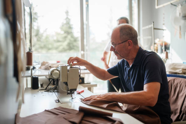 istock The tailor is sewing the fabric on the sewing machine. 2157981991