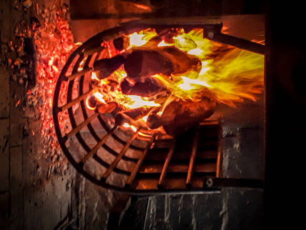 istock Iron curved stove with burning woods 2157982302