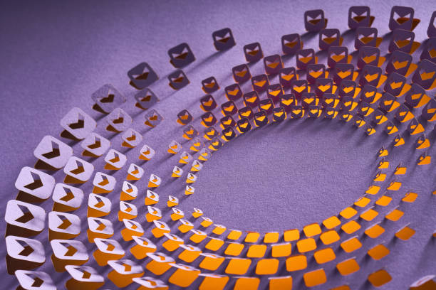 Native image size: 7952 x 5304. This imaginative still life photograph showcases an innovative cut paper artwork. The design features a circular array of orange and purple shapes meticulously arranged on a violet background. The overlapping patterns and shadows create a dynamic and visually engaging effect, highlighting the intricate craftsmanship involved. This image is ideal for illustrating creative paper art techniques and the beauty of geometric designs.