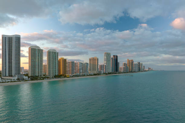 istock Expensive highrise hotels and condos over sandy beachfront on Atlantic ocean shore in Sunny Isles Beach city at sunset. American tourism infrastructure in southern Florida 2157989719