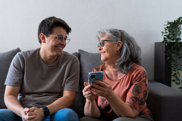istock Son and Mother Enjoying Time Together on the Couch 2157989758