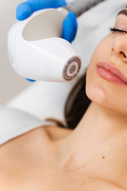 istock Face-lifting with help of special cosmetology device. Needle-free rf-lifting process. 2157994397