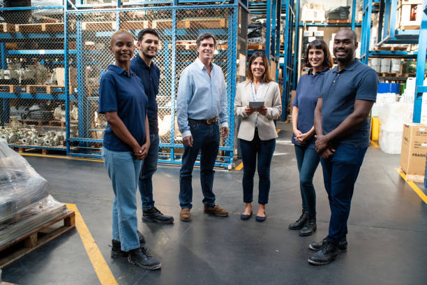 istock Group of logistics team standing together in distribution warehouse 2157998545