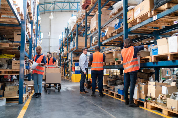 istock Multiracial warehouse workers engaged in daily operations 2157998608