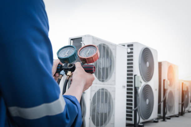istock Technician is checking air conditioner,measuring equipment for filling air conditioners. 2157999300