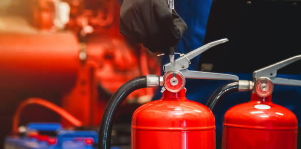 istock Engineer check fire extinguisher tank in the fire control room for safety in factory or industry. 2157999326