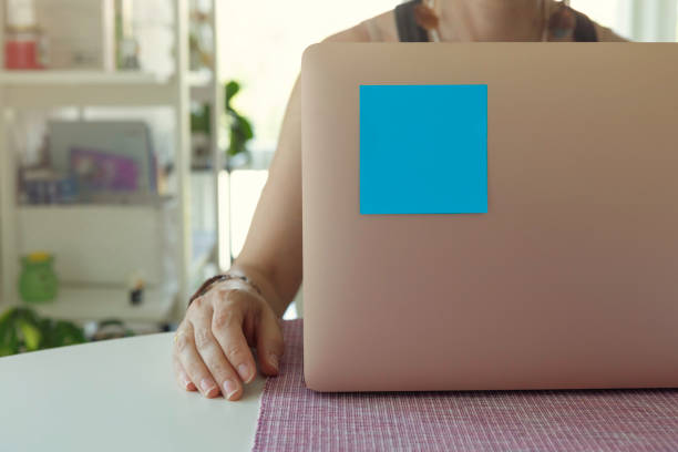 istock Woman using laptop at home 2158000358