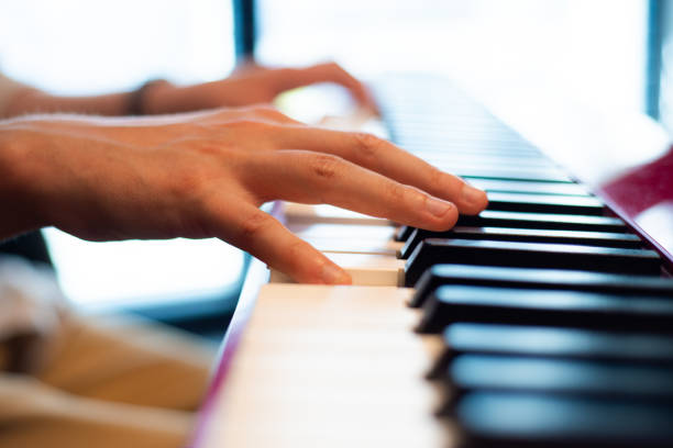 istock Music school. Playing the piano. Hands on keyboard 2158002138