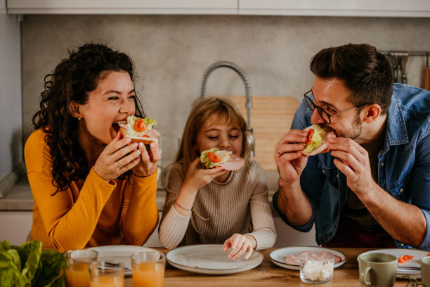 istock Family eating breakfast together 2158002674