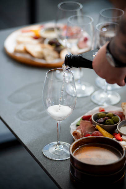 istock Wine tasting. Sommelier pours wine into a glass 2158003301