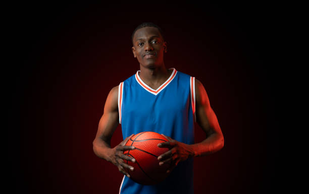 istock Basketball player holding ball 2158005853