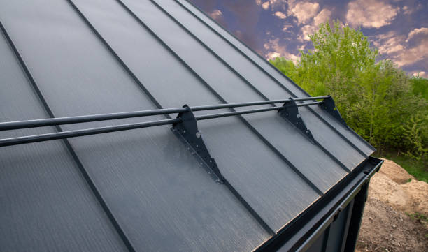 istock Snow rails are installed on gray seam roof 2158006590
