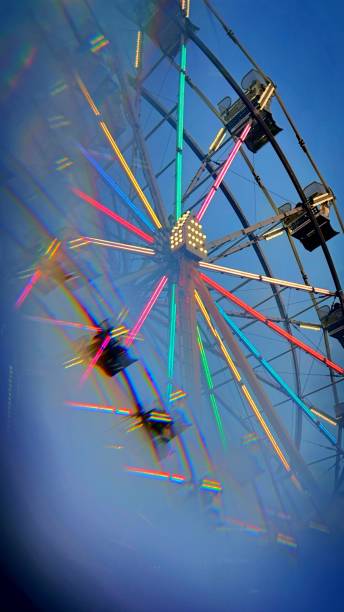 istock Partial Kaleidoscope Image Ferris Wheel Dusk • Stock Photo 2158009319
