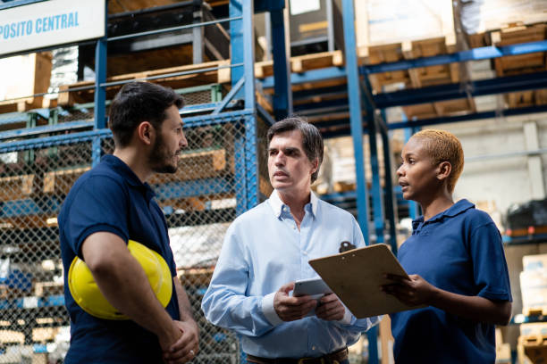 istock Multiracial group of people having meeting at distribution warehouse 2158009611