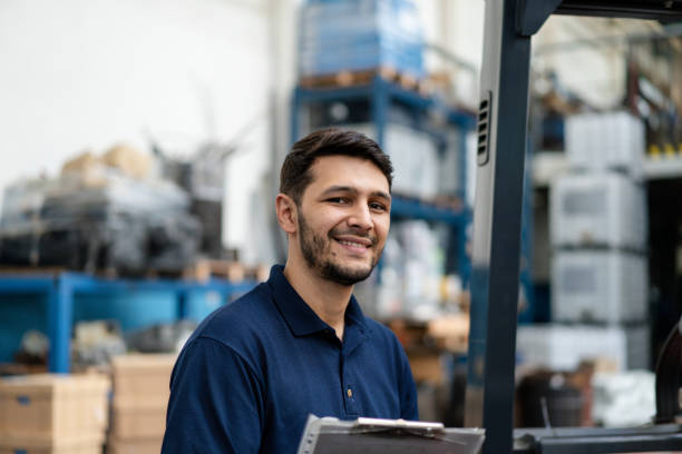 istock Portriat of happy warehouse worker with clipboard 2158009621