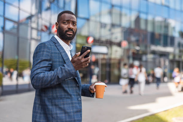 istock Grown up, a businessman, a black man next to an office building 2158010694