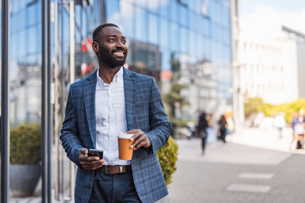 istock Grown up, a businessman, a black man next to an office building 2158010699