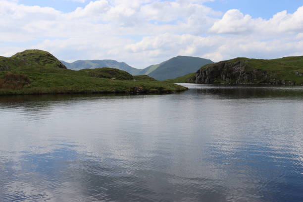 Wide angle view of Buttermere at sunrise. Buttermere is a lake in the Lake District National Park in North West England.