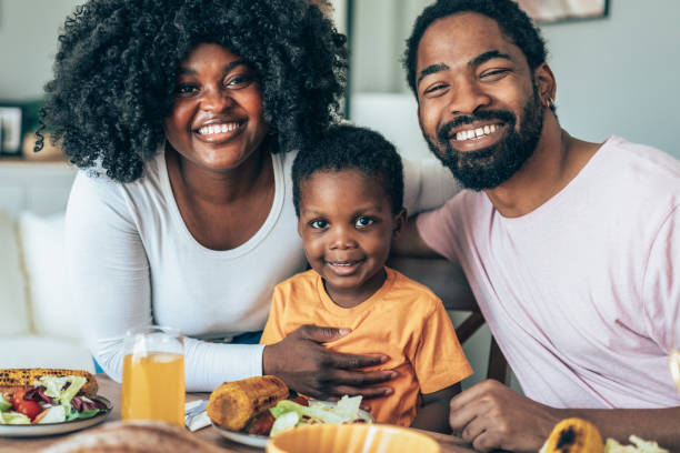 istock Family with a little boy eating together 2158013465