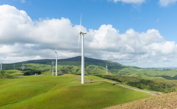 istock Wind turbines along farm ridge under cloudy sky. 2158013507