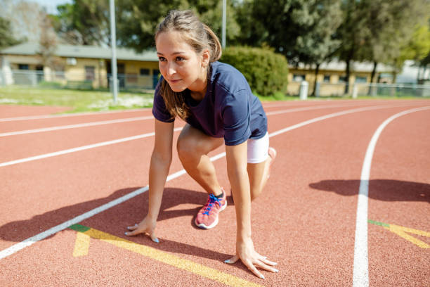 istock woman ready on the run track 2158016025