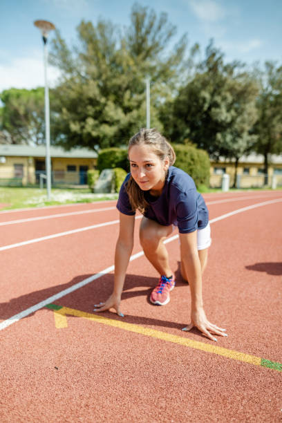 istock woman ready on the run track 2158016083