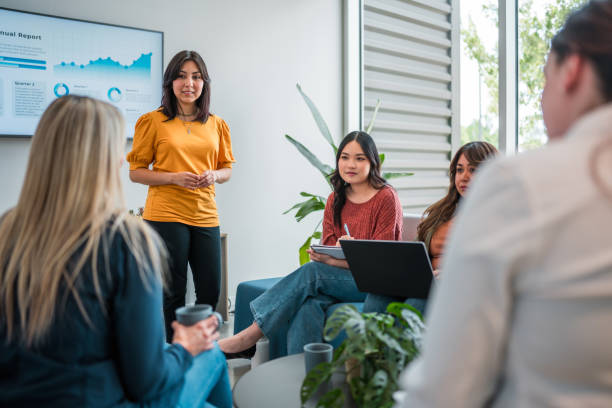 istock Hispanic Businesswoman Leads Corporate Presentation 2158016314