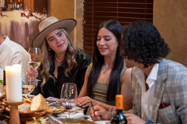 istock Friends enjoy luxury meal at restaurant 2158018182