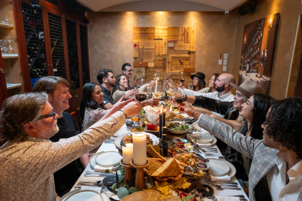 istock Friends enjoy luxury meal at restaurant 2158018267