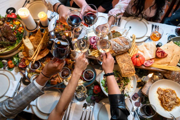 istock Friends enjoy luxury meal at restaurant 2158018335
