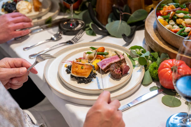 istock Senior man enjoys meal at luxury restaurant 2158018336