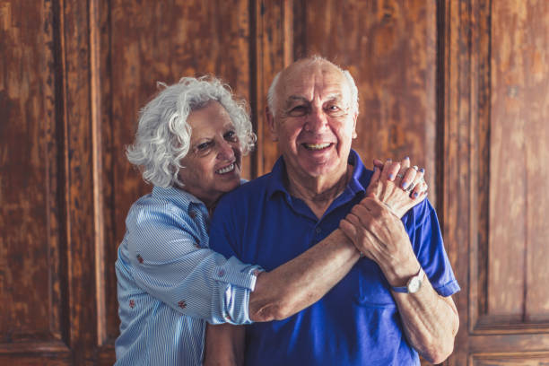 istock Happy Senior Couple Embracing in Morning 2158019730