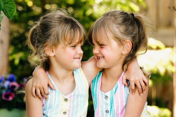 istock Twin Girls in Garden 2158020076
