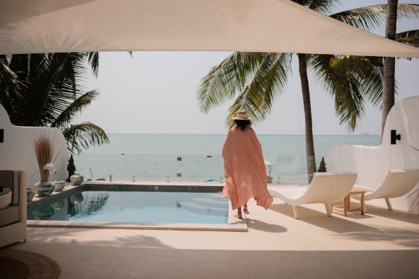 istock Woman on vacation in paradise 2158022596