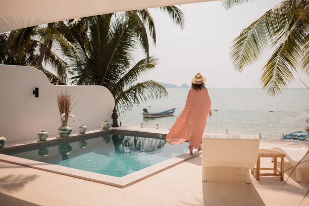 istock Woman on vacation in paradise 2158022637
