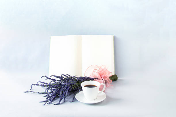 istock lavender bouquet and book and coffee.  white background. 2158025746